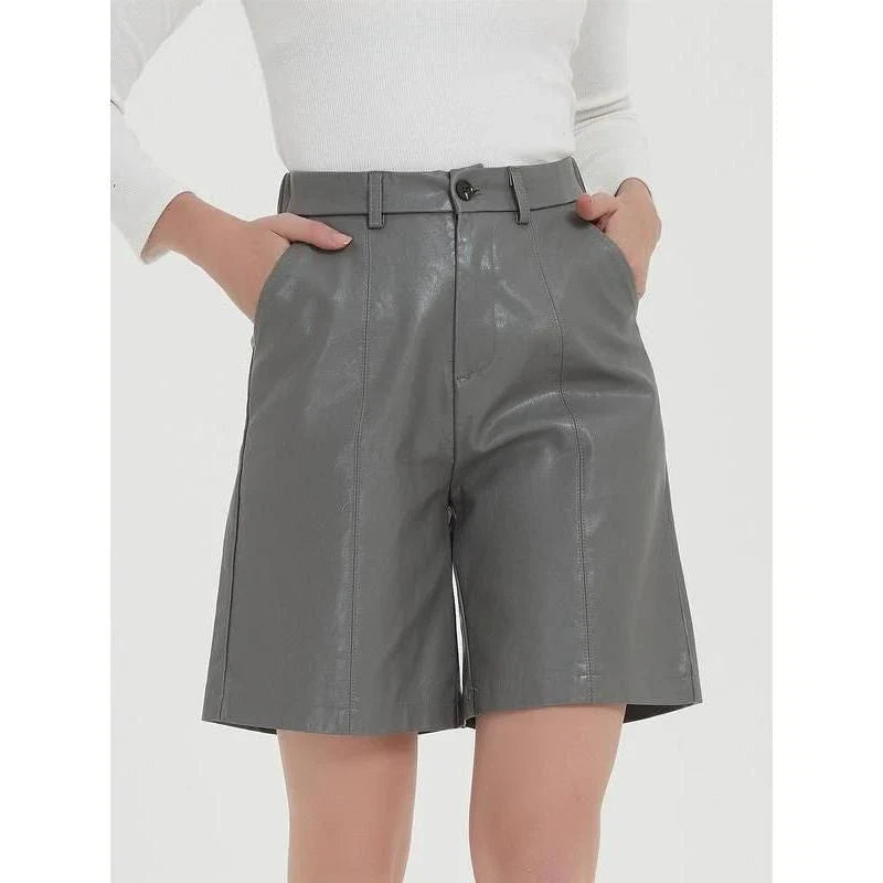 Elegant knee-length PU leather shorts for women in gray, featuring a regular fit design with a mid-rise waist and elastic waistband for maximum comfort and style.