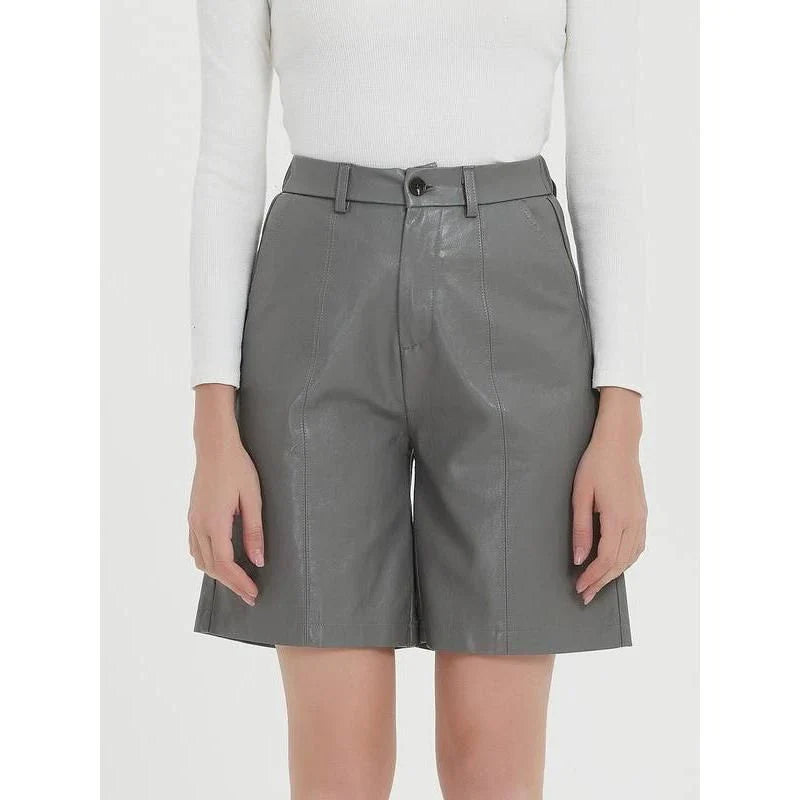 Elegant knee-length PU leather shorts for women in gray, featuring a regular fit design with a mid-rise waist and elastic waistband for maximum comfort and style.