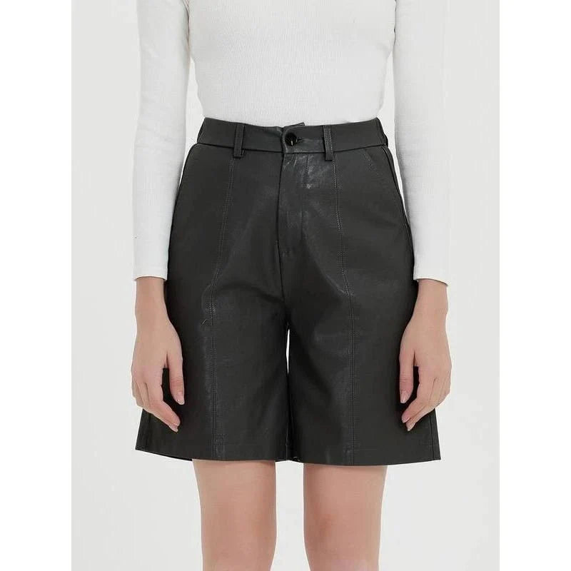Elegant knee-length PU leather shorts for women in gray, featuring a regular fit design with a mid-rise waist and elastic waistband for maximum comfort and style.