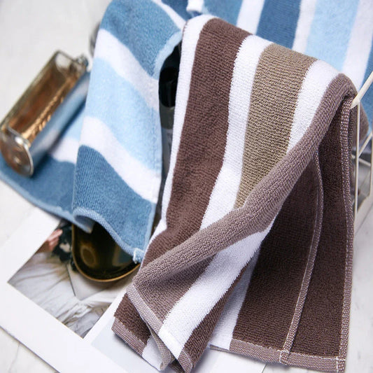 Luxurious cotton bath and face towel with brown, white, and blue striped design