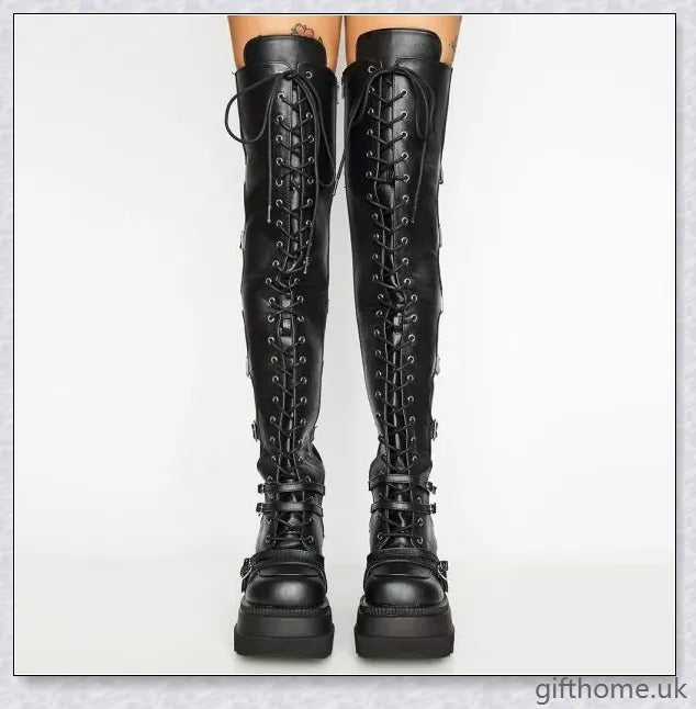 Stylish high platform thigh-high boots with fashionable buckle detailing, perfect for adding a touch of punk-inspired elegance to your outfit.