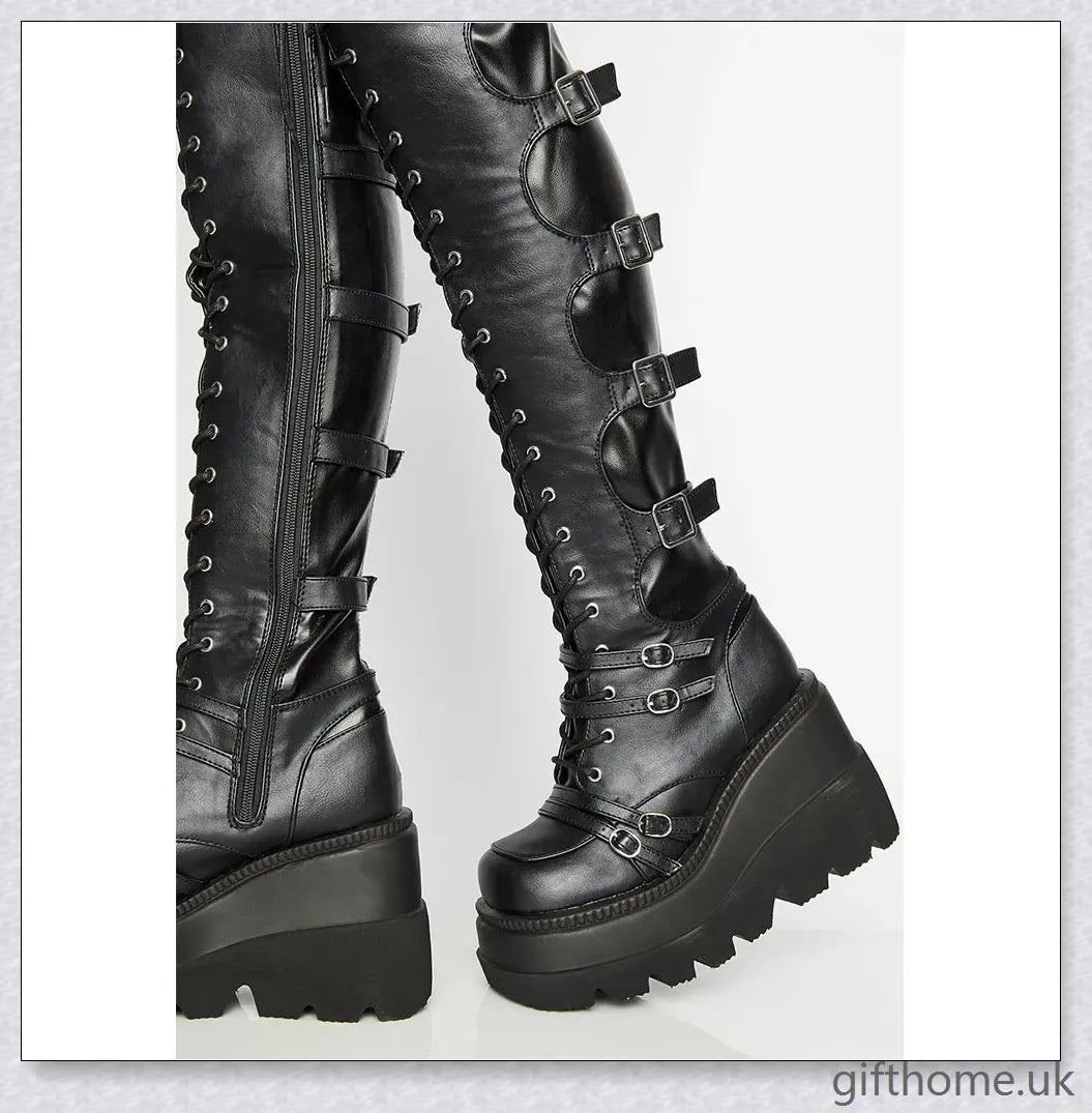 Stylish high platform thigh-high boots with fashionable buckle detailing, perfect for adding a touch of punk-inspired elegance to your outfit.