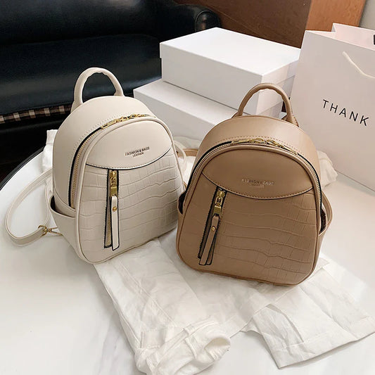 A chic and versatile all-match fashion small backpack in khaki, featuring a spacious square vertical design, premium PU leather construction, and polyester cotton lining for a timeless British-inspired look.
