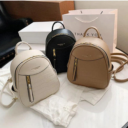 A chic and versatile all-match fashion small backpack in khaki, featuring a spacious square vertical design, premium PU leather construction, and polyester cotton lining for a timeless British-inspired look.