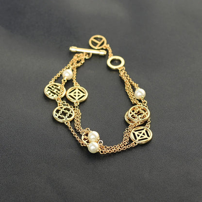 Elegant double hollow bracelet with a captivating cross, crown, or Roman numeral pattern, crafted with premium plated alloy materials.