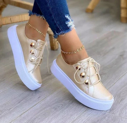 Lace-up flats sneakers for women with rivet detailing and a variety of colour options