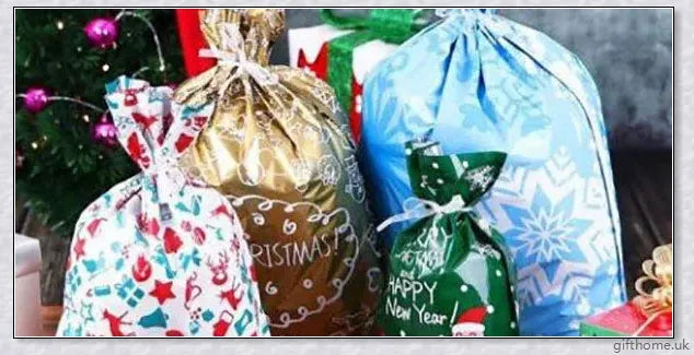 15 sets of drawstring Christmas gift bags in various sizes and festive designs