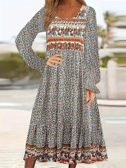 A beautifully printed dress with a round neckline, pullover design, and long sleeves in a variety of colours