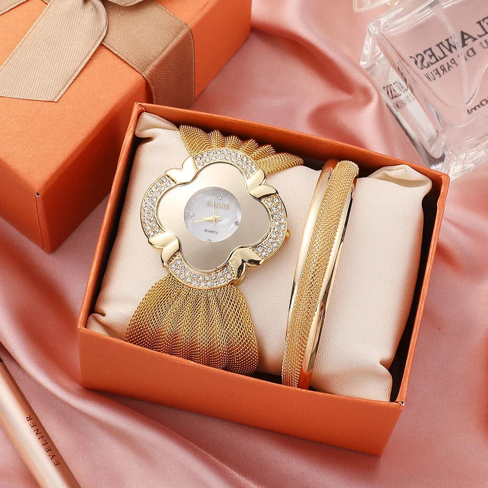 Elegant floral-patterned watch with a gold and silver mesh strap