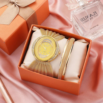 Elegant floral-patterned watch with a gold and silver mesh strap