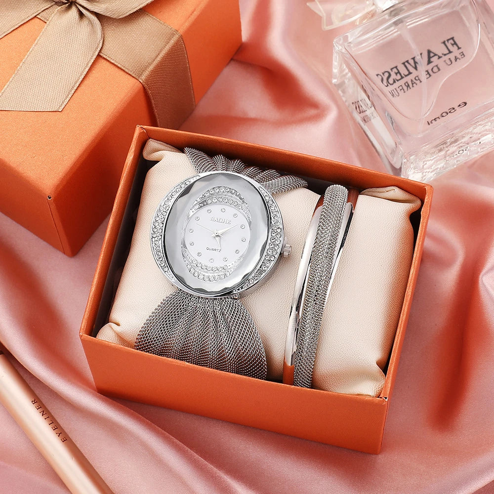 Elegant floral-patterned watch with a gold and silver mesh strap