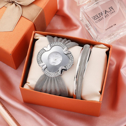 Elegant floral-patterned watch with a gold and silver mesh strap