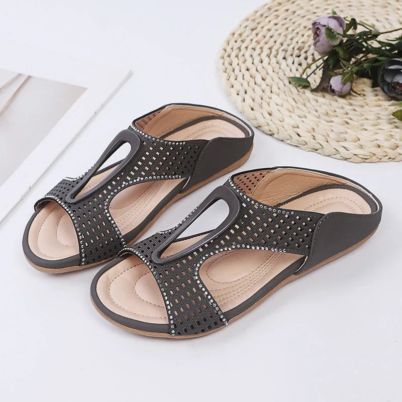 Fashionable rhinestone-embellished casual slippers with a hollow design, available in a range of sizes for comfortable all-day wear.