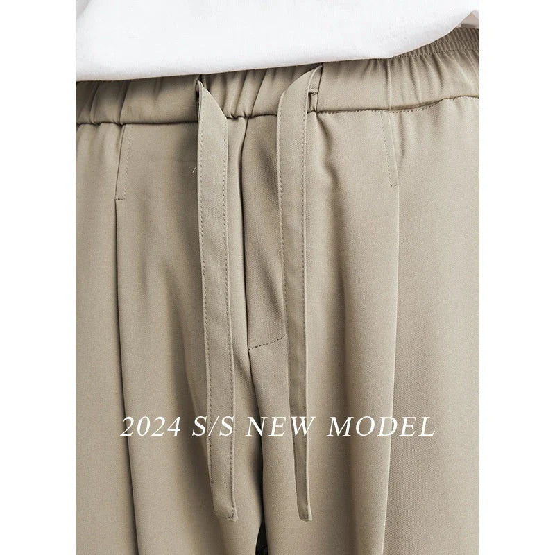 Sophisticated ice silk straight-leg trousers in a range of colours, designed with advanced draping and wrinkle-resistant properties for effortless style.