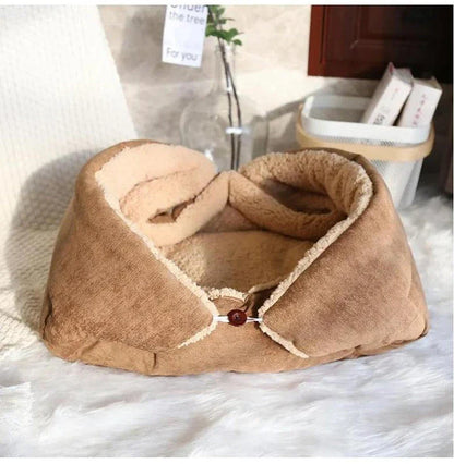 Cosy winter cat bed in plush brown fabric with a charming cartoon design, providing a warm and comfortable retreat for feline companions.