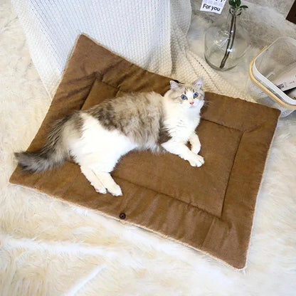Cosy winter cat bed in plush brown fabric with a charming cartoon design, providing a warm and comfortable retreat for feline companions.