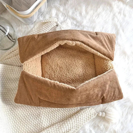 Cosy winter cat bed in plush brown fabric with a charming cartoon design, providing a warm and comfortable retreat for feline companions.