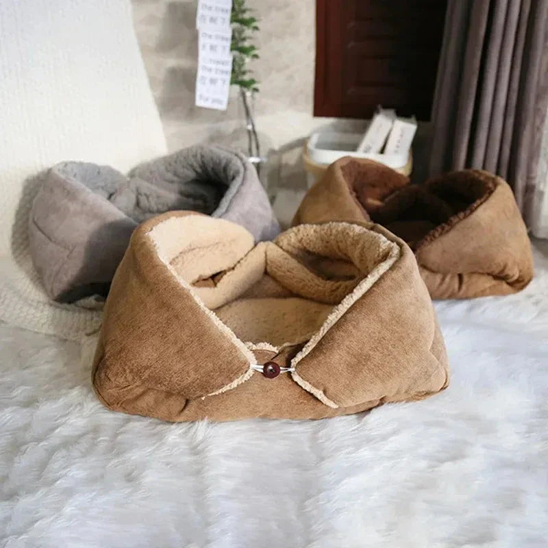Cosy winter cat bed in plush brown fabric with a charming cartoon design, providing a warm and comfortable retreat for feline companions.