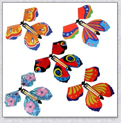 Colourful magic flying butterflies taking flight from a greeting card or book, creating a delightful surprise