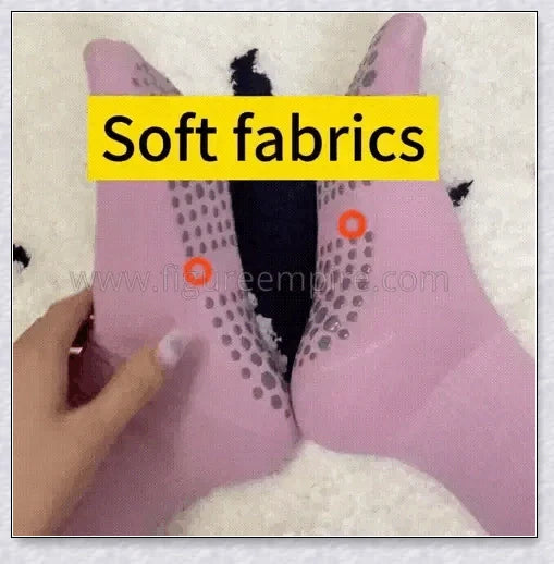 A pair of self-warming massage socks in black, red, and white colours