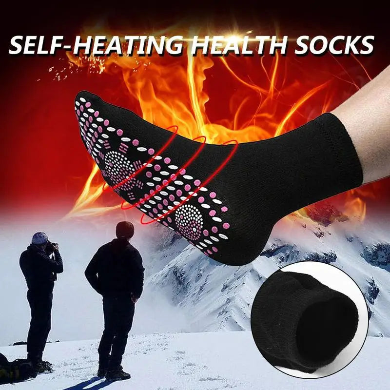 A pair of self-warming massage socks in black, red, and white colours