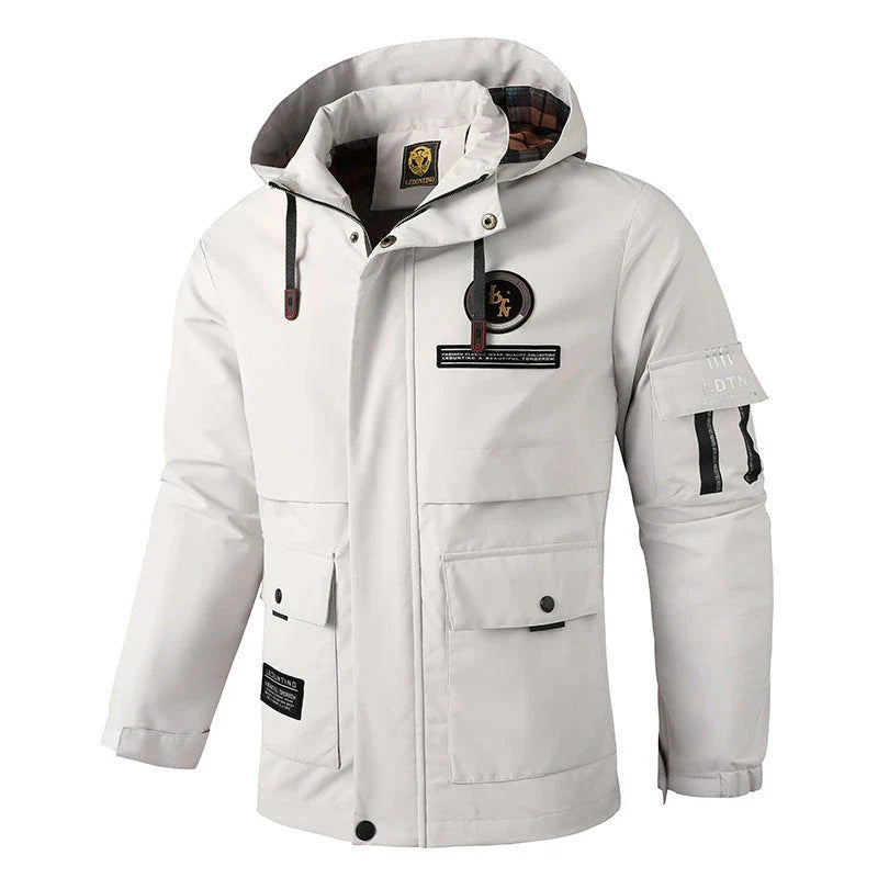 Premium waterproof hooded jacket in black, red, and white colours with dimensional patch pockets and a straight hem design.