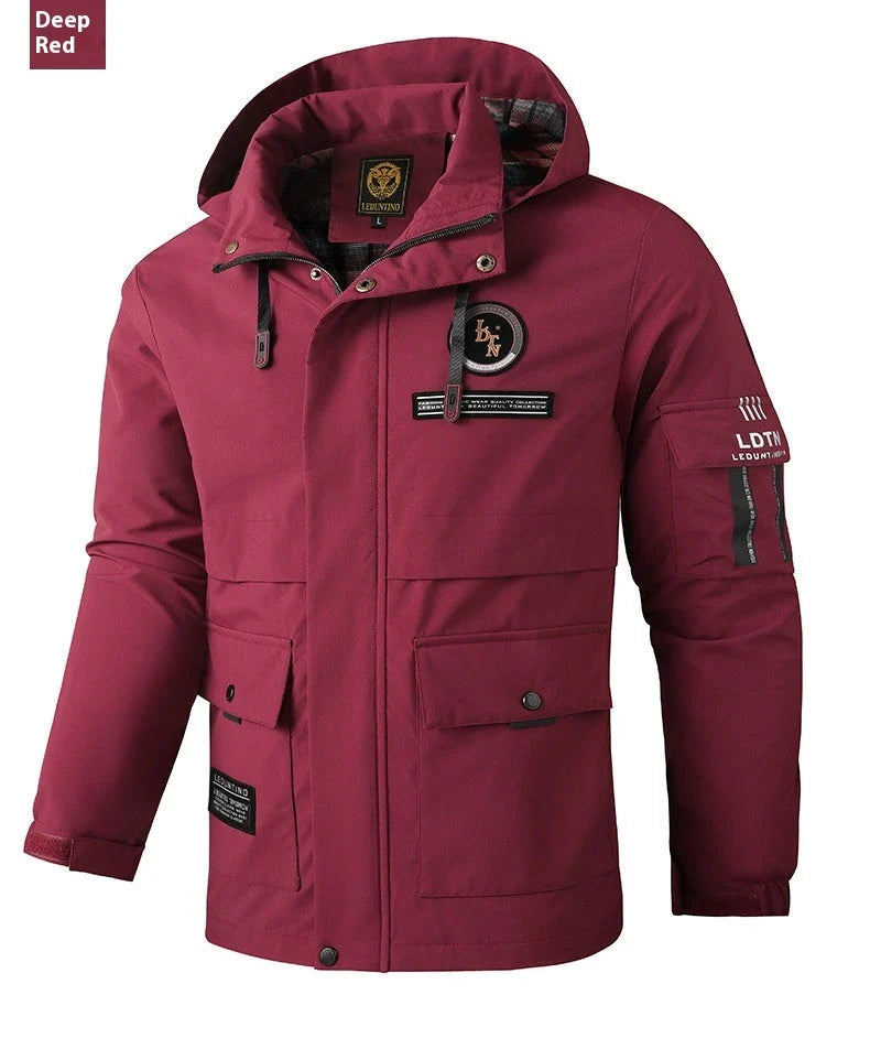 Premium waterproof hooded jacket in black, red, and white colours with dimensional patch pockets and a straight hem design.