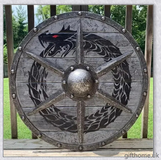 Authentic battle-worn Viking shield with two ravens design and iron spikes, adorned with Celtic buckle and rune characters