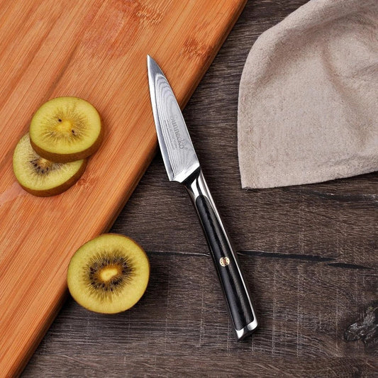 A premium Damascus steel fruit paring knife with a sleek, ergonomic design for effortless slicing and dicing in the kitchen.