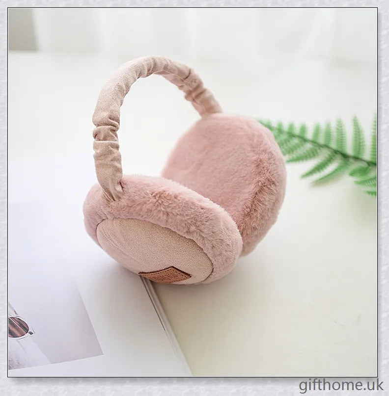 Bluetooth headphones with warm, plush earmuffs in a foldable, adjustable design for comfortable winter wear