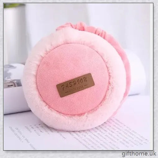 Bluetooth headphones with warm, plush earmuffs in a foldable, adjustable design for comfortable winter wear
