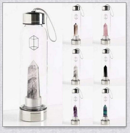 A natural crystal water bottle made of borosilicate glass, featuring a variety of healing crystals inside to enhance your hydration experience.