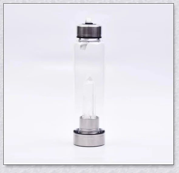 A natural crystal water bottle made of borosilicate glass, featuring a variety of healing crystals inside to enhance your hydration experience.