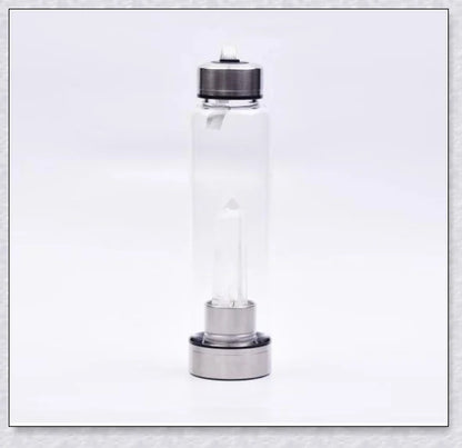 A natural crystal water bottle made of borosilicate glass, featuring a variety of healing crystals inside to enhance your hydration experience.