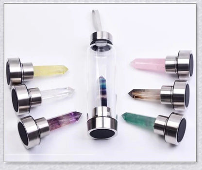 A natural crystal water bottle made of borosilicate glass, featuring a variety of healing crystals inside to enhance your hydration experience.