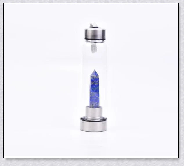 A natural crystal water bottle made of borosilicate glass, featuring a variety of healing crystals inside to enhance your hydration experience.