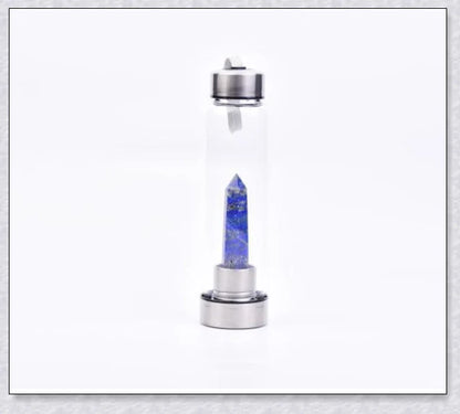 A natural crystal water bottle made of borosilicate glass, featuring a variety of healing crystals inside to enhance your hydration experience.