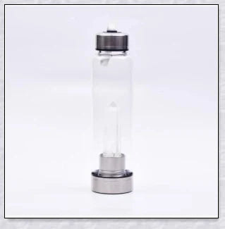 A natural crystal water bottle made of borosilicate glass, featuring a variety of healing crystals inside to enhance your hydration experience.