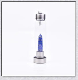 A natural crystal water bottle made of borosilicate glass, featuring a variety of healing crystals inside to enhance your hydration experience.