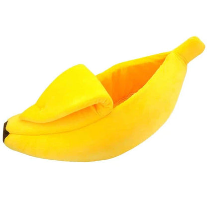 Cosy banana-shaped bed for cats in bright yellow colour, providing a comfortable and stylish resting spot for felines.