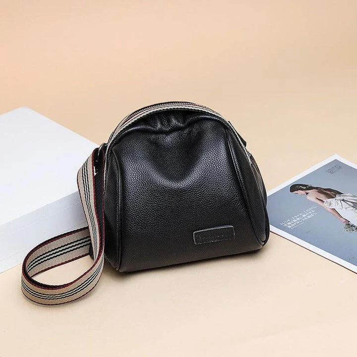 Premium cowhide one-shoulder messenger bag in classic colours for versatile daily use