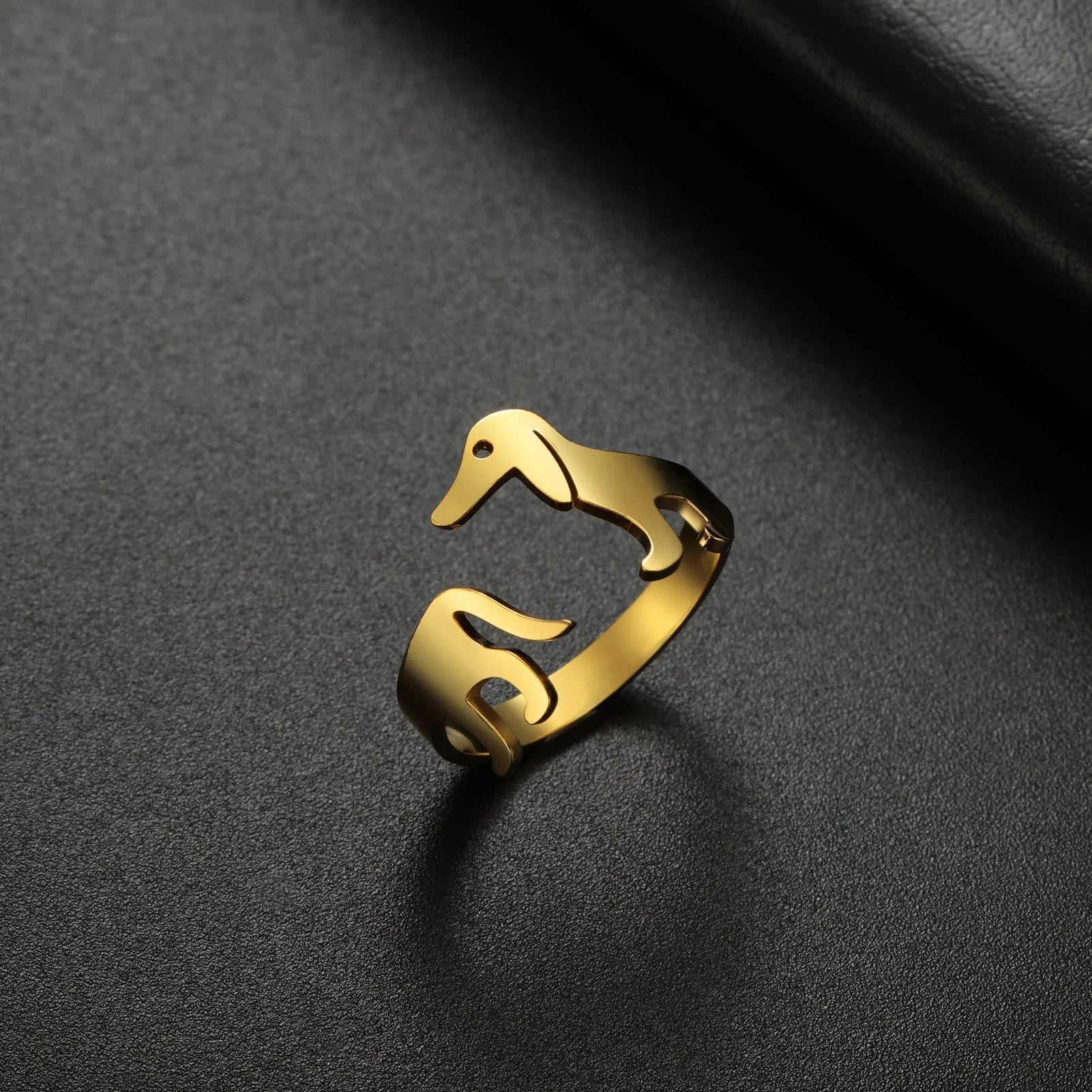 Adjustable titanium steel ring featuring a playful sausage dog design