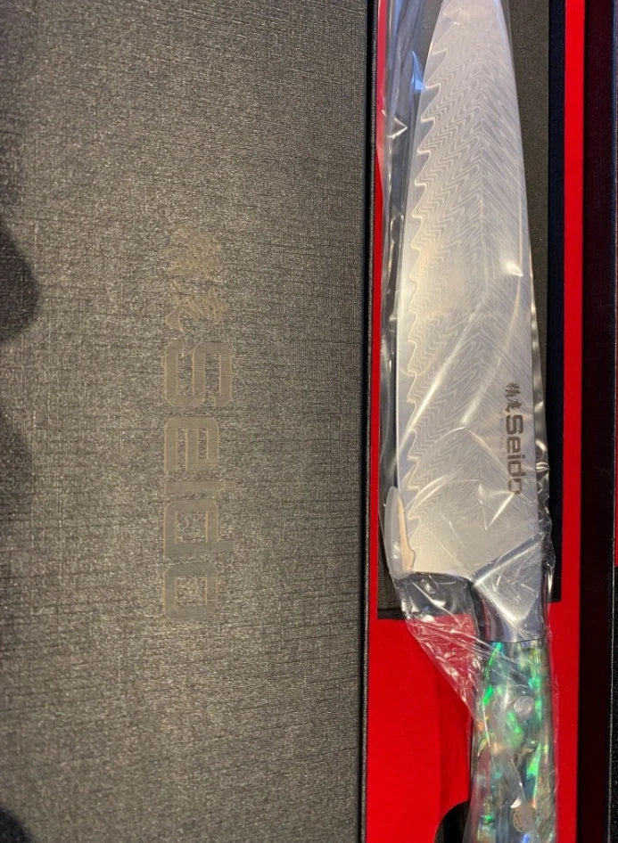 A premium 5-piece Japanese-style Seido Santoku knife set made of high-quality stainless steel, featuring a chef's knife, Santoku knife, bone knife, universal knife, and peeler