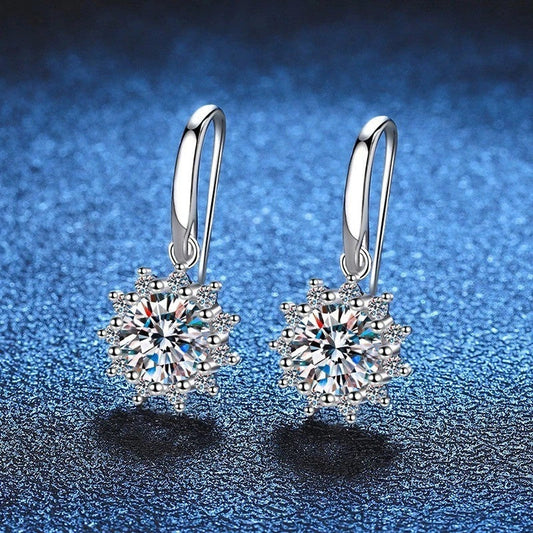 A pair of elegant sunflower-shaped ear studs in a gleaming white gold tone, showcasing the intricate floral design and premium craftsmanship.