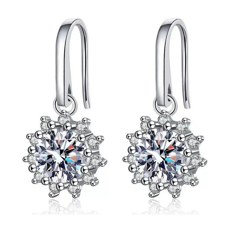 A pair of elegant sunflower-shaped ear studs in a gleaming white gold tone, showcasing the intricate floral design and premium craftsmanship.