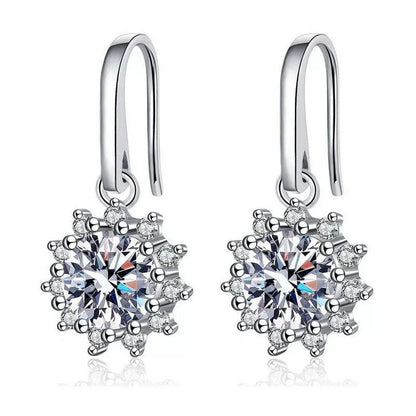 A pair of elegant sunflower-shaped ear studs in a gleaming white gold tone, showcasing the intricate floral design and premium craftsmanship.