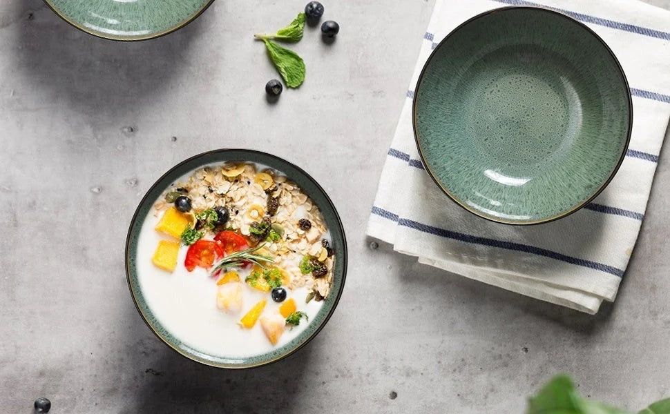 Set of four peacock green ceramic bowls with kiln change finish, 30oz capacity