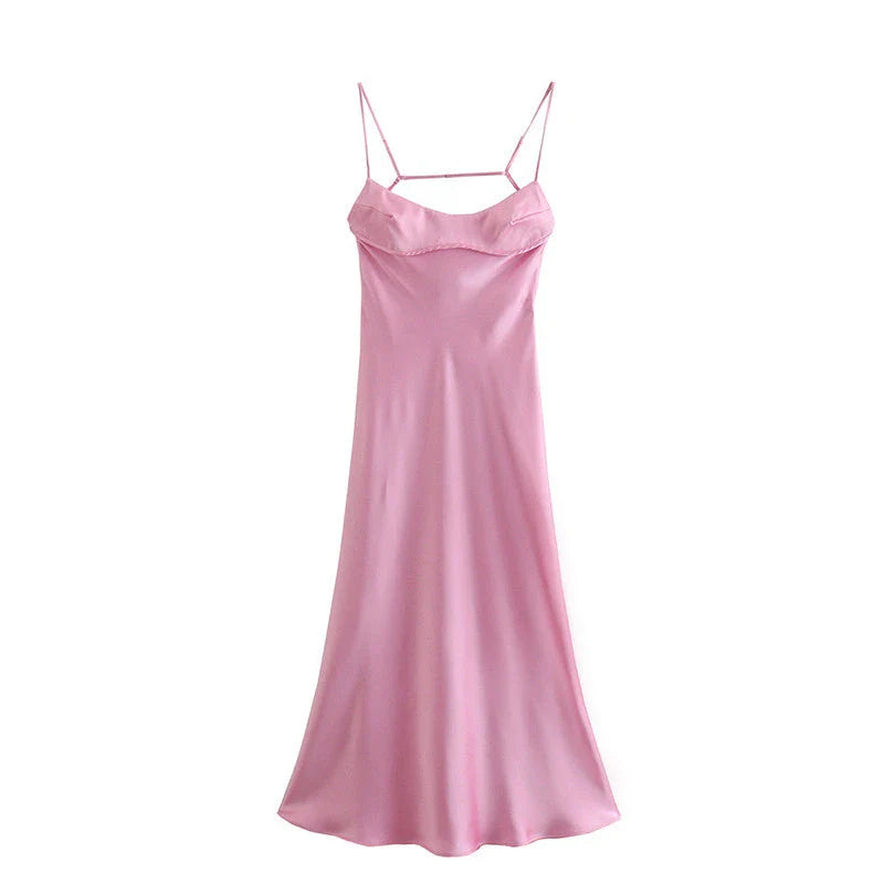 A sleek and elegant satin slip dress in a stunning pink color with a backless design and full-length silhouette.