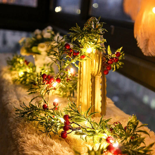 Festive Christmas lights with a decorative leaf garland, creating a cosy, enchanting display for the holiday season