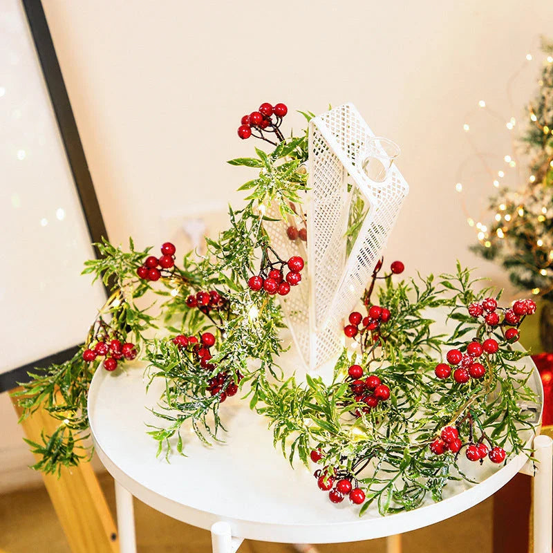 Festive Christmas lights with a decorative leaf garland, creating a cosy, enchanting display for the holiday season